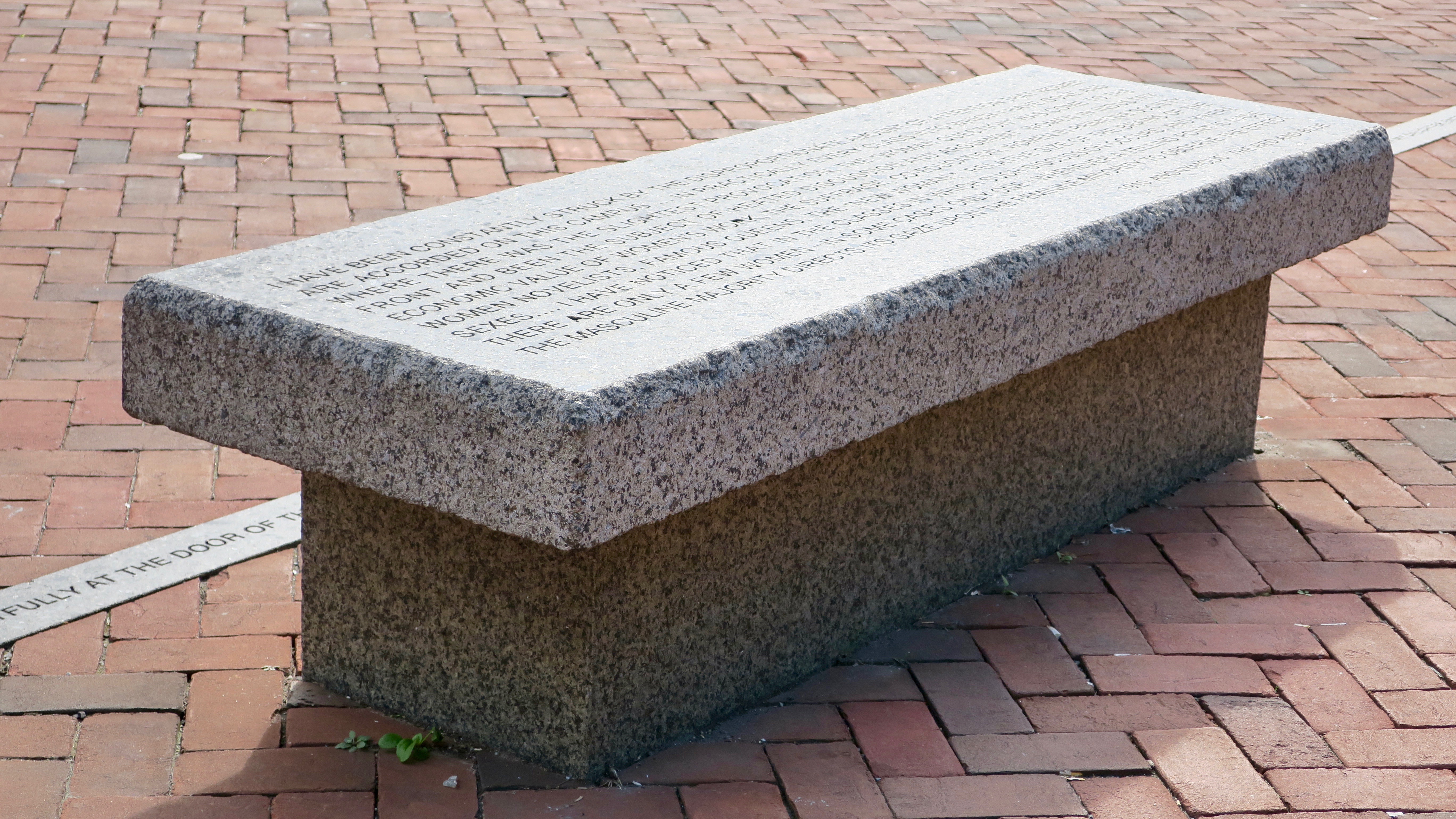 granite bench and curbing on brick walkway