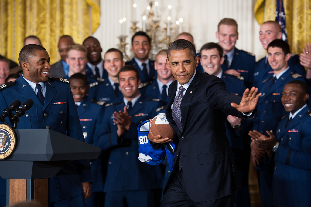 President Obama does the Heisman pose with members of the Air Force Academy football team