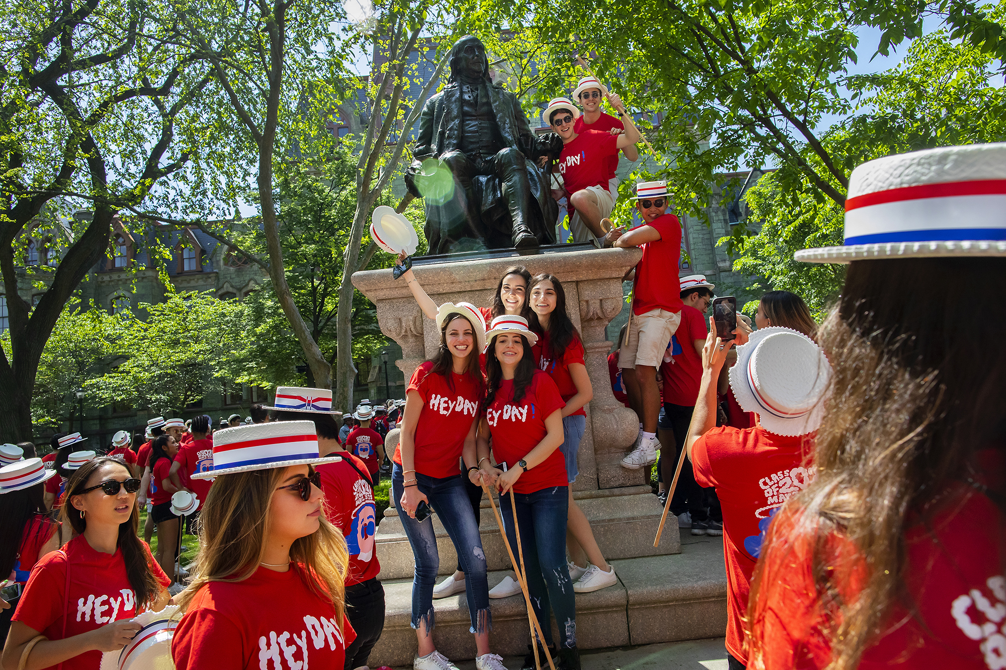 students on ben franklin statue during hey day