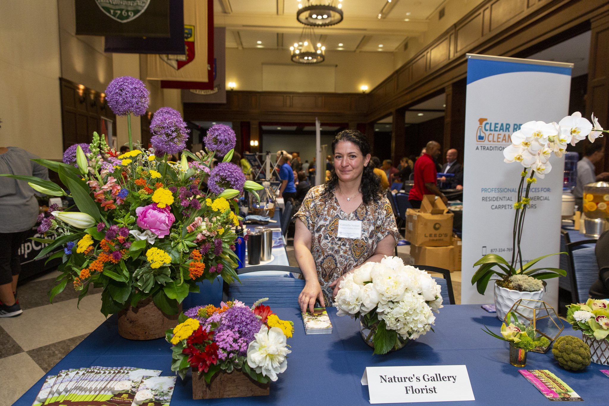 Gabriella Nemati, of Nature’s Gallery Florist, at her table at the expo