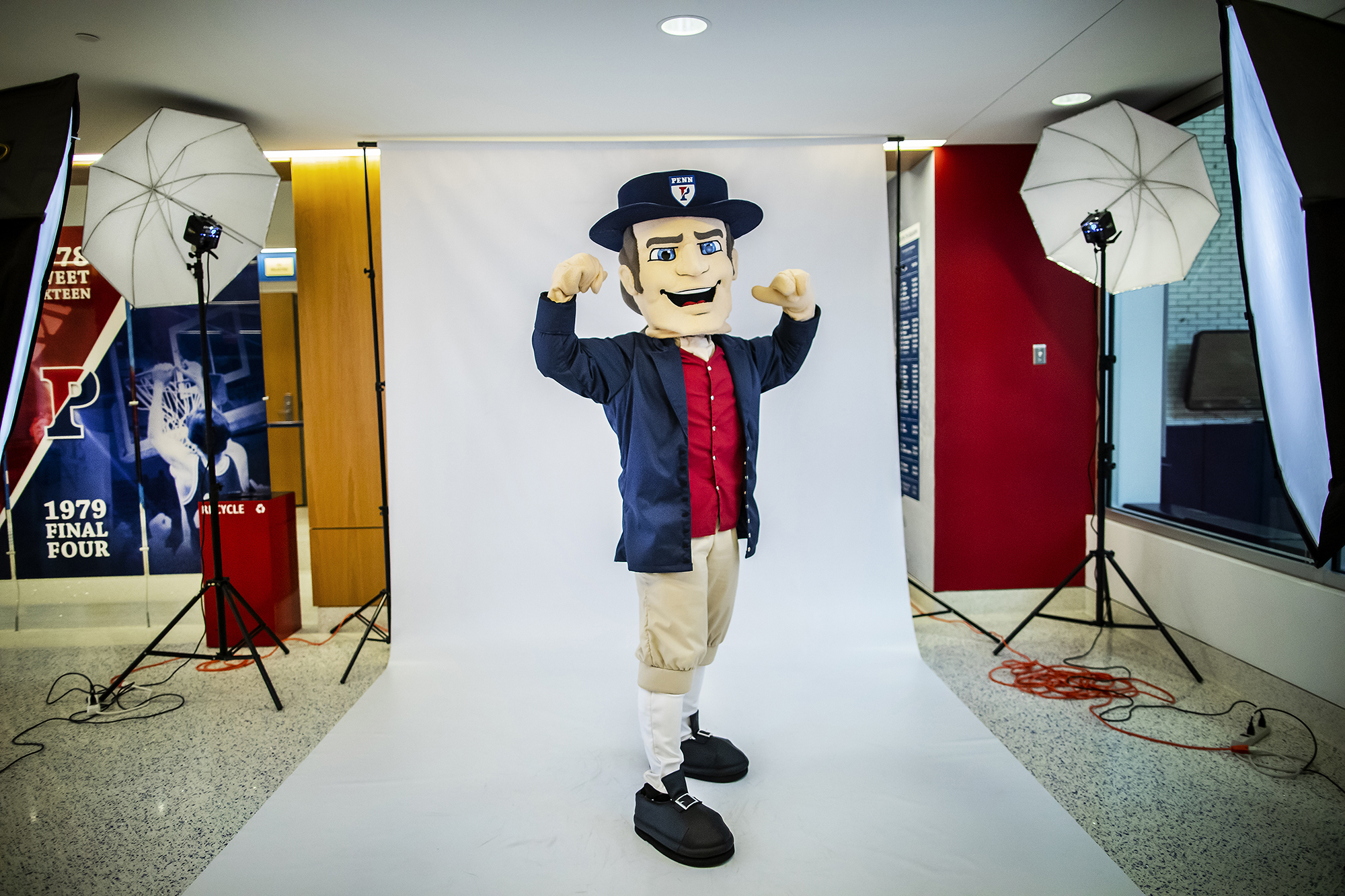 The Quaker poses showing his bicep muscles during a photo shoot.