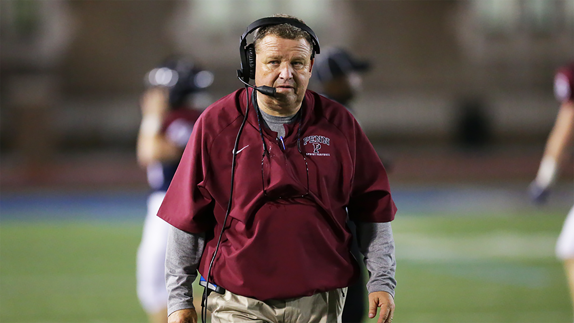 Jerry McConnell of the Penn sprint football team patrols the sidelines.