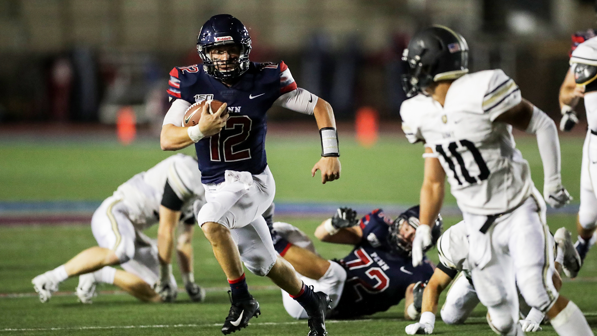 Quarterback Eddie Jenkins runs with the ball against Army at Franklin Field.