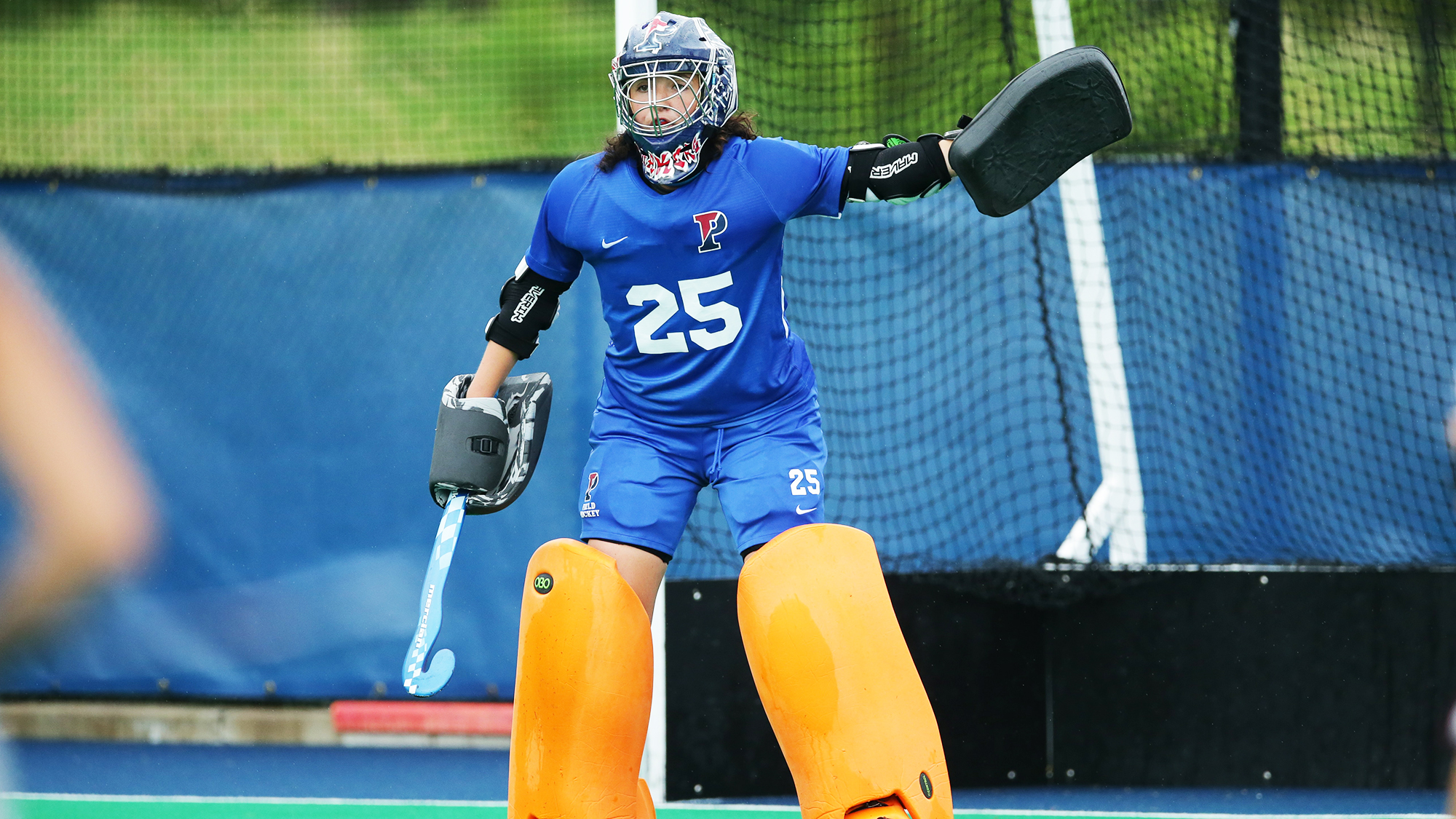 Ava Rosati stands in the goal with her pads on during a game.
