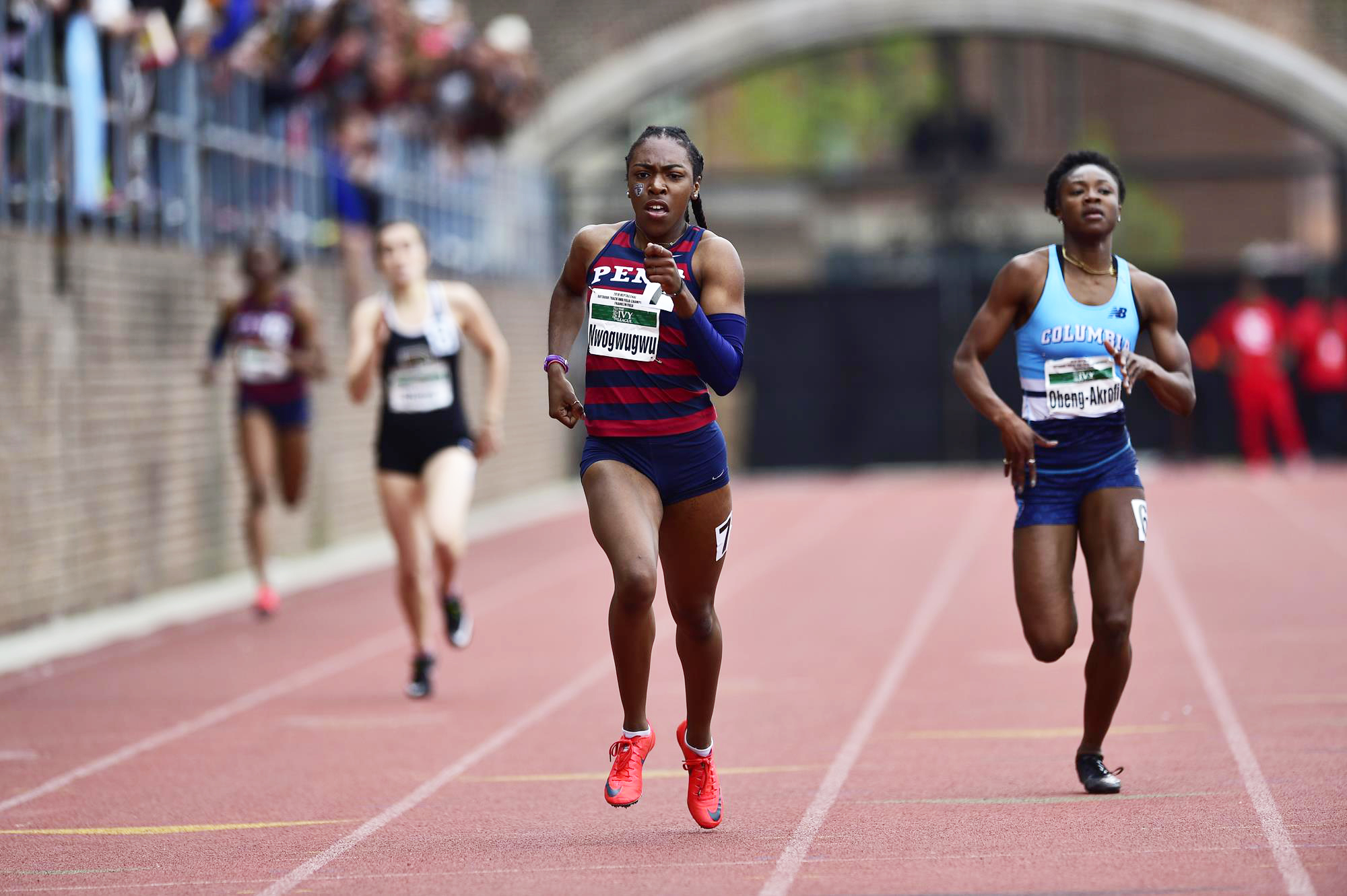 Uchechi Nwogwugwu of the track and field team runs at the front of the pack during a race.