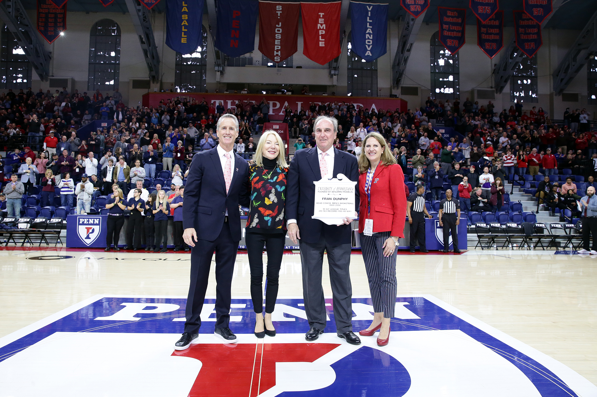 Fran Dunphy is honored during the Penn vs. Temple basketball game. He stands with Coach Donahue, President Gutmann, and AD Calhoun.