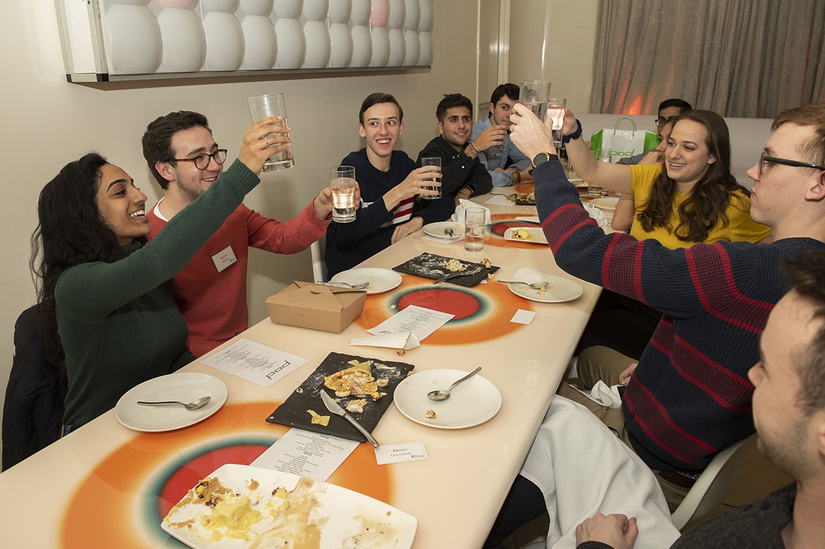 UA students toast at dinner
