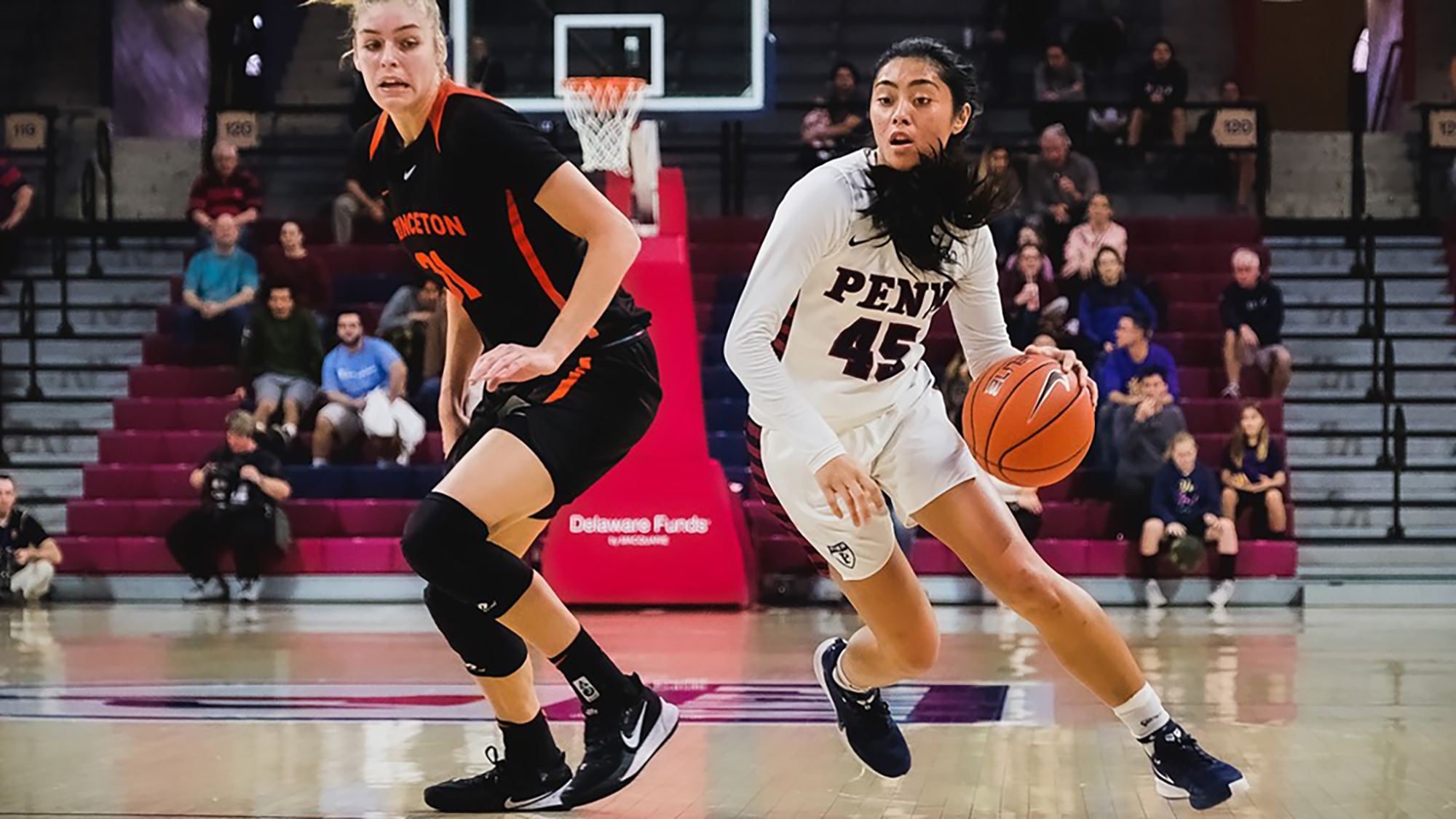 Kayla Padilla of the basketball teams drive to the basket against Princeton at the Palestra.