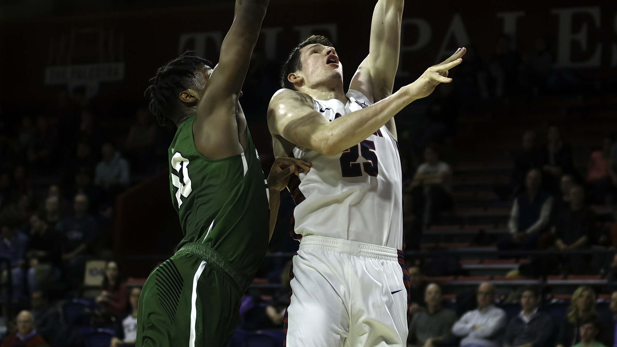 Senior forward A.J. Brodeur goes up for a layup against Dartmouth.