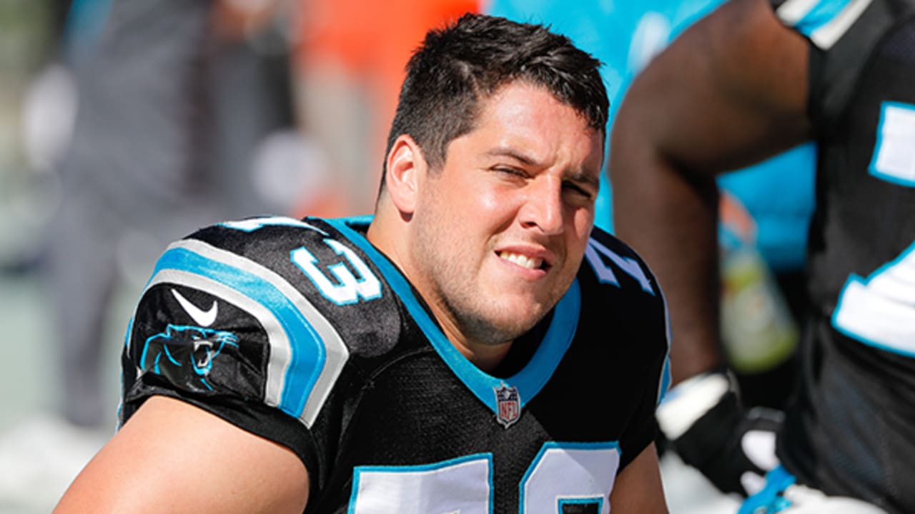 Wear his Carolina Panthers uniform, Greg Van Roten sits on the bench during a game.