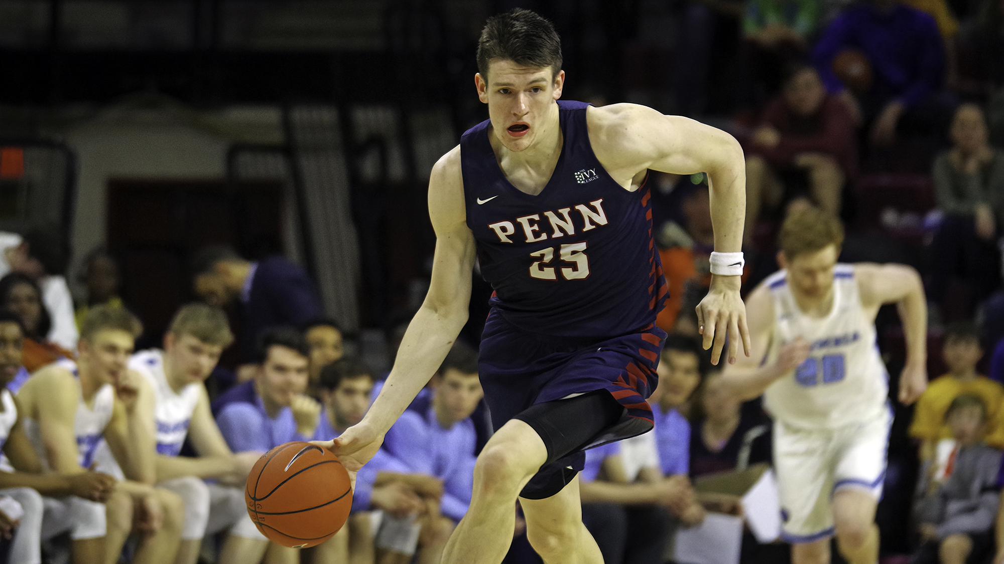 A.J. Brodeur dribbles the ball up the court against Columbia.