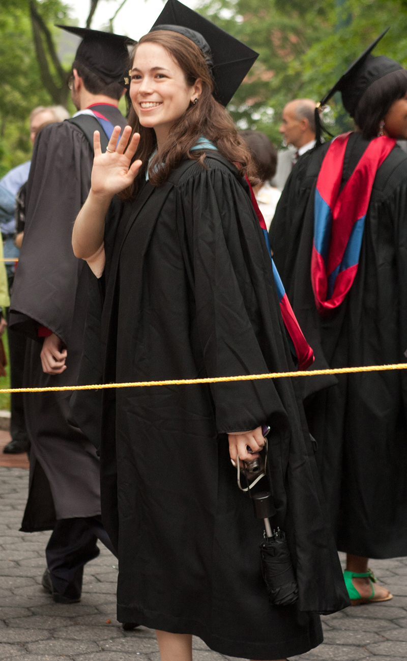 Miller's daughter Roberta Miller on her graduation day, waving for photo