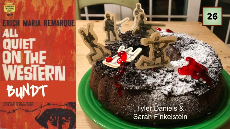 A chocolate bundt cake with soldier cutouts on top next to the book jacket for All Quiet on the Western Front