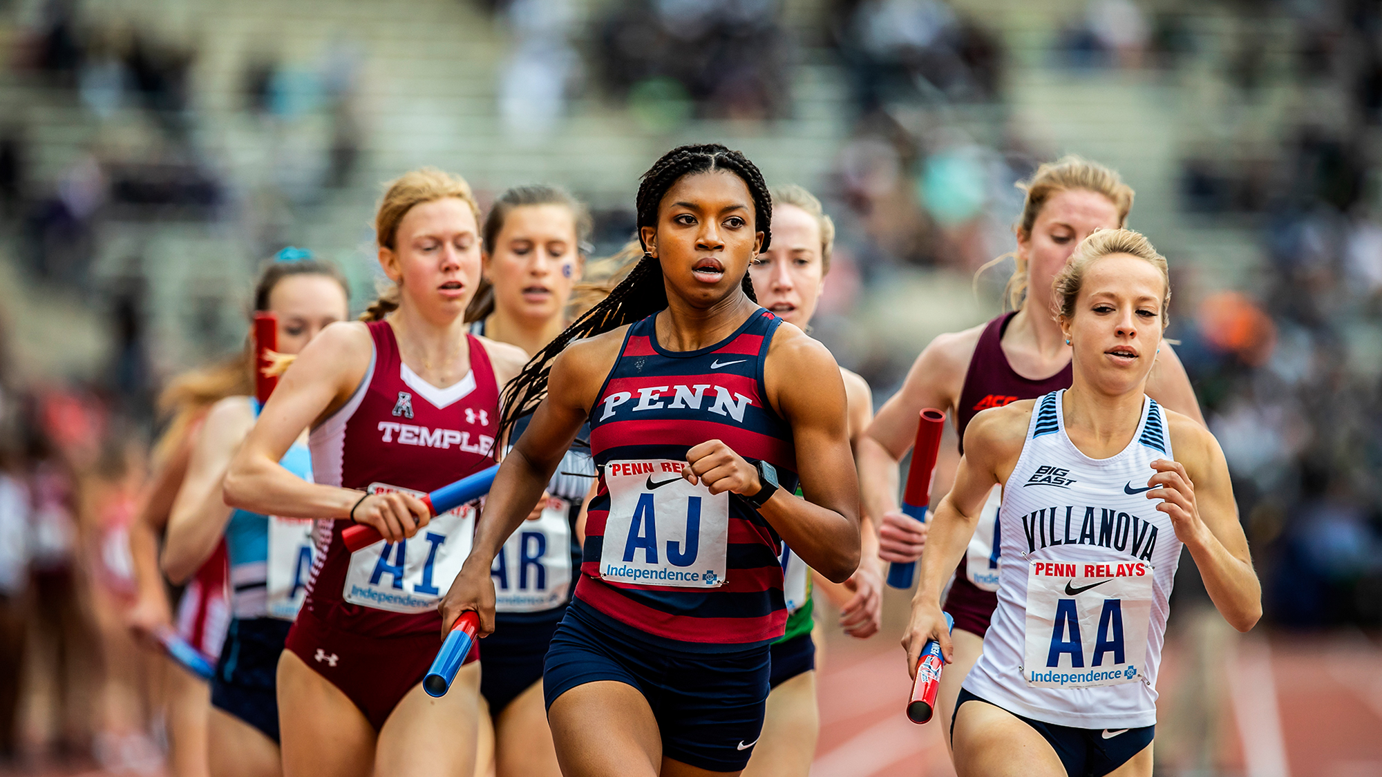 Nia Akins leads a pack of runners during the Penn Relays.