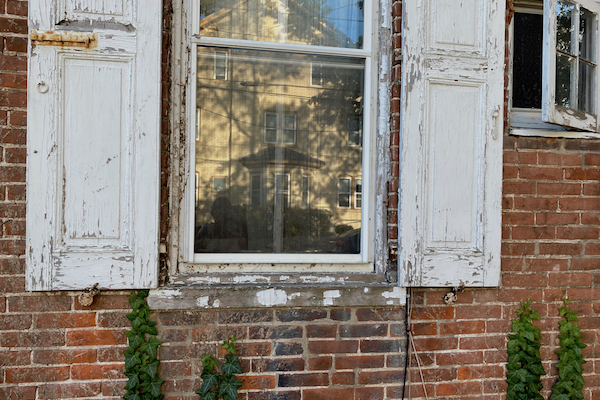 A window with peeling paint