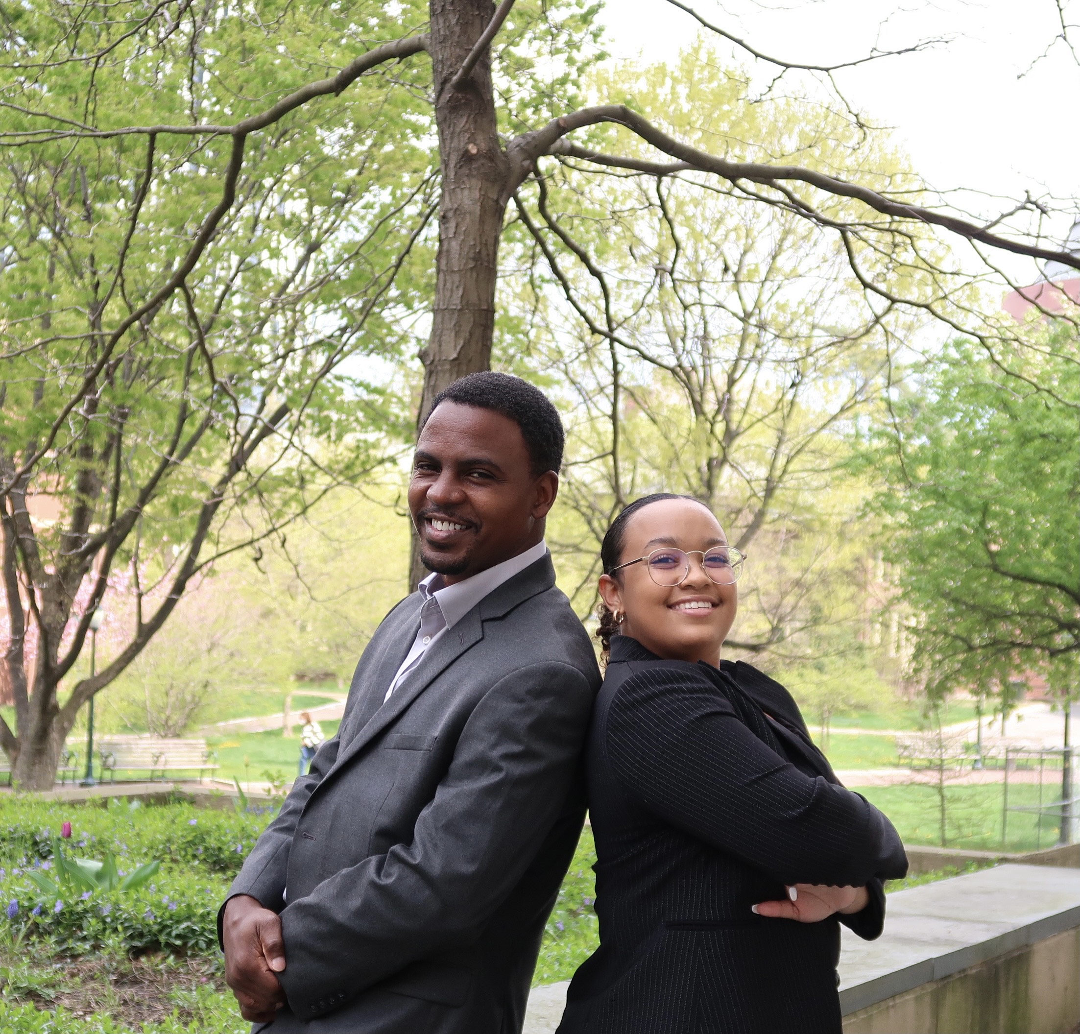 Kaiyla and Daniel Gillion pose for a photo outside on campus