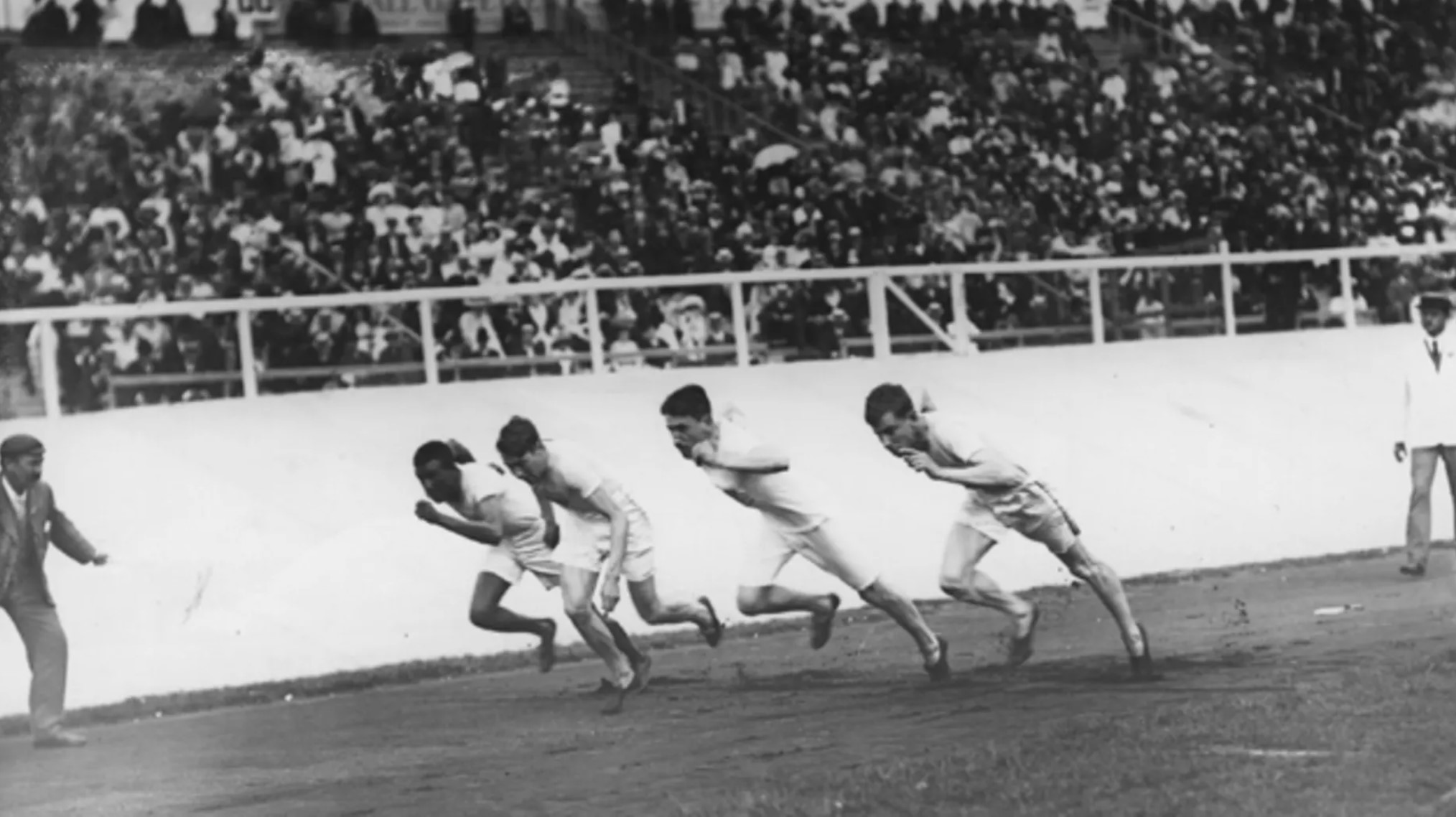 John Baxter Taylor, left, runs in a race during the 1908 Olympics.