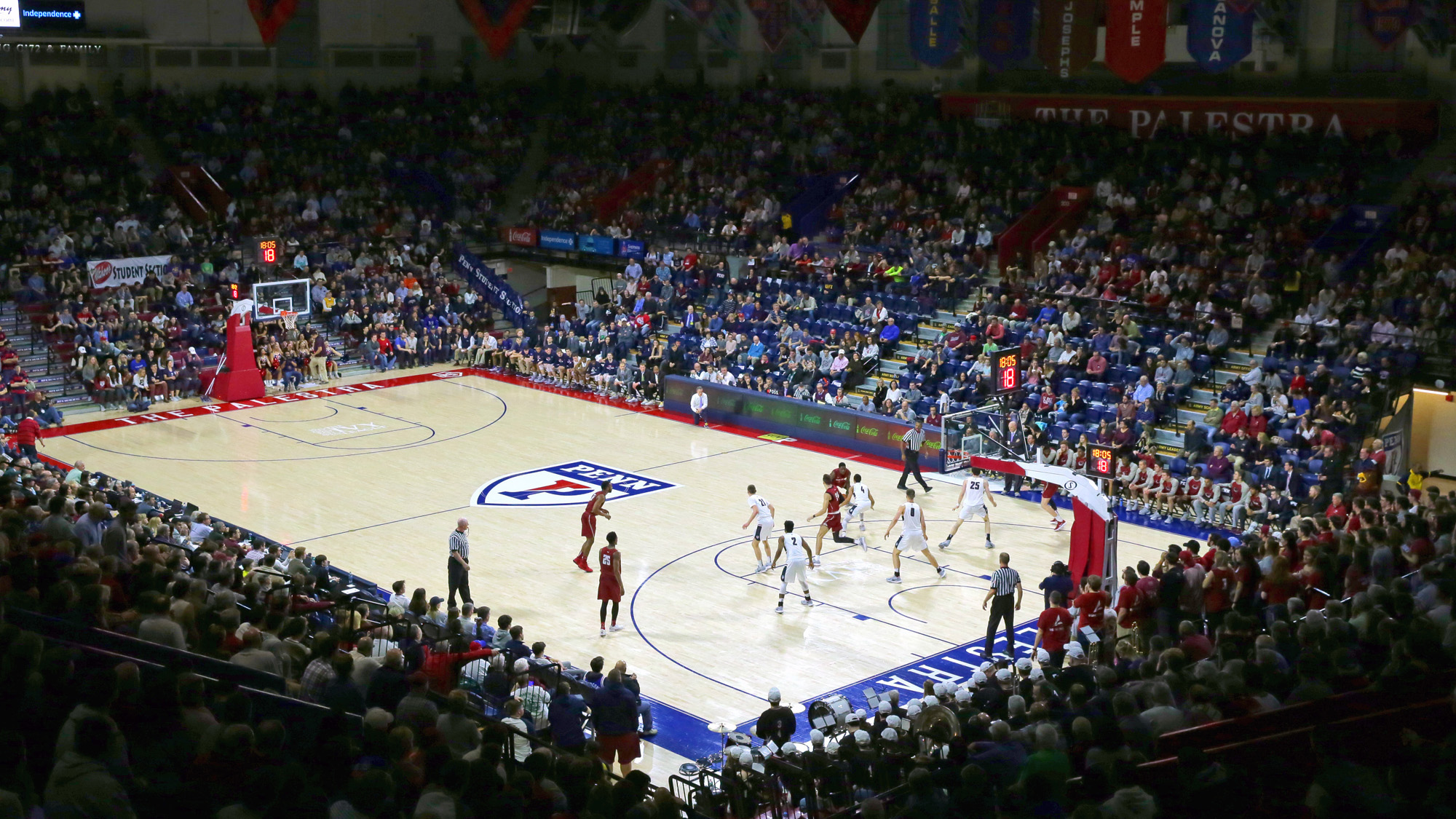 Penn's men's basketball team plays a home game at the Palestra in front of a packed crowd.