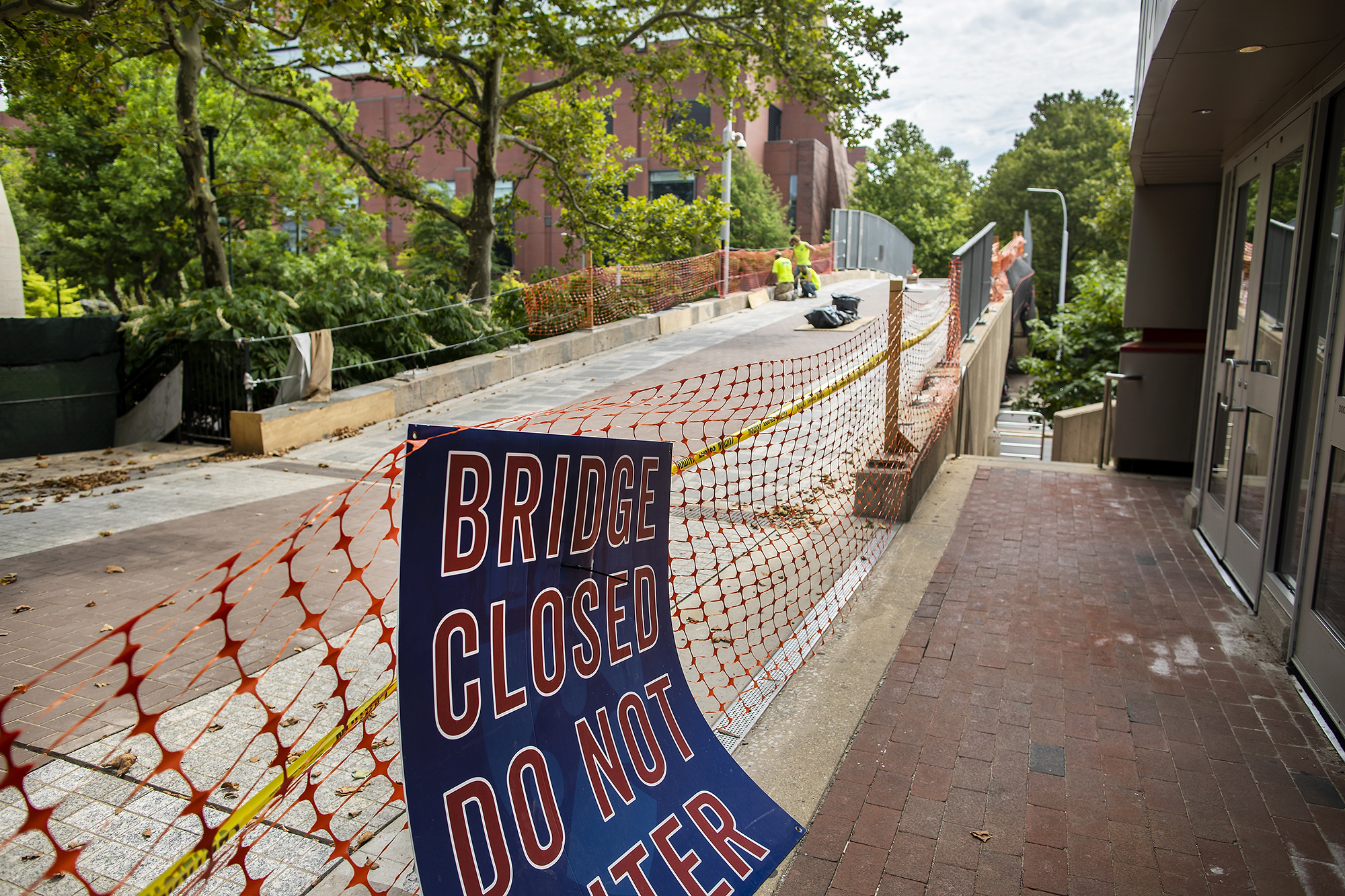 A sign at the foot of the Locust Walk Bridge that reads BRIDGE CLOSED DO NOT ENTER.