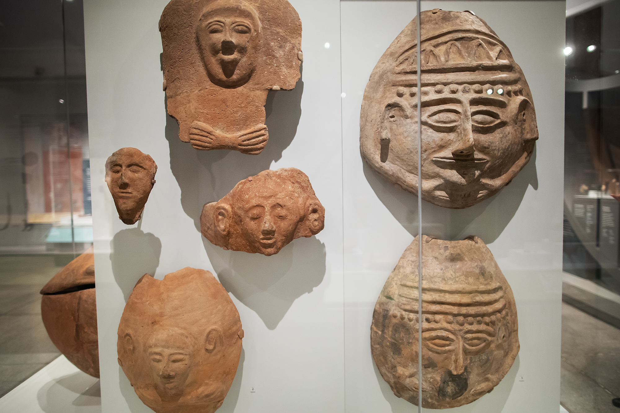 six faces made of clay