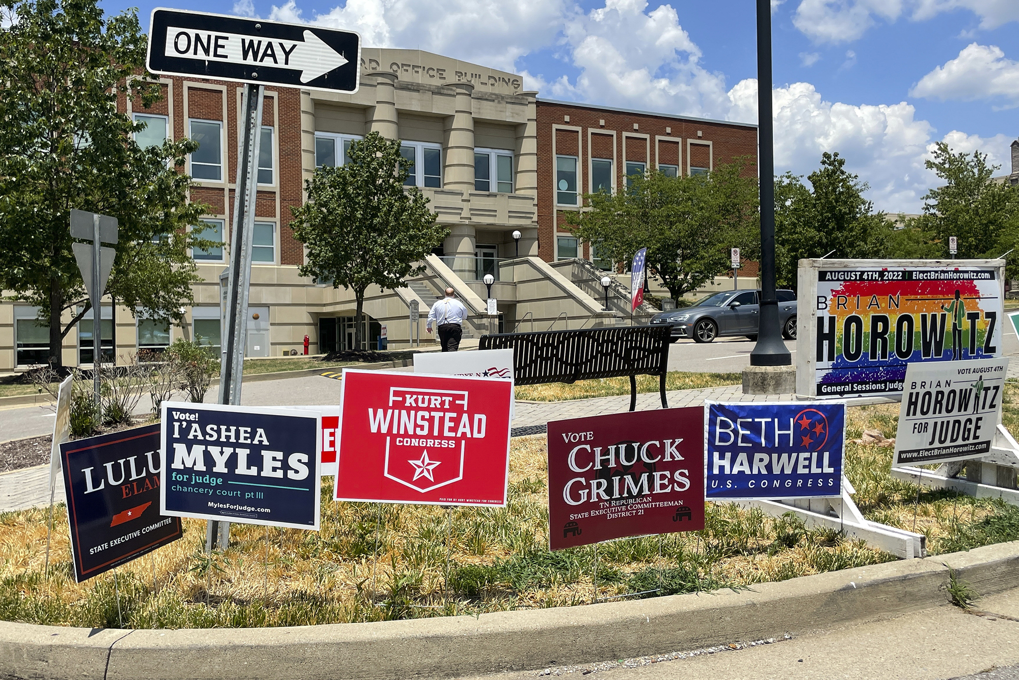 Campaign signs dot a lawn outside a Tennessee polling location.