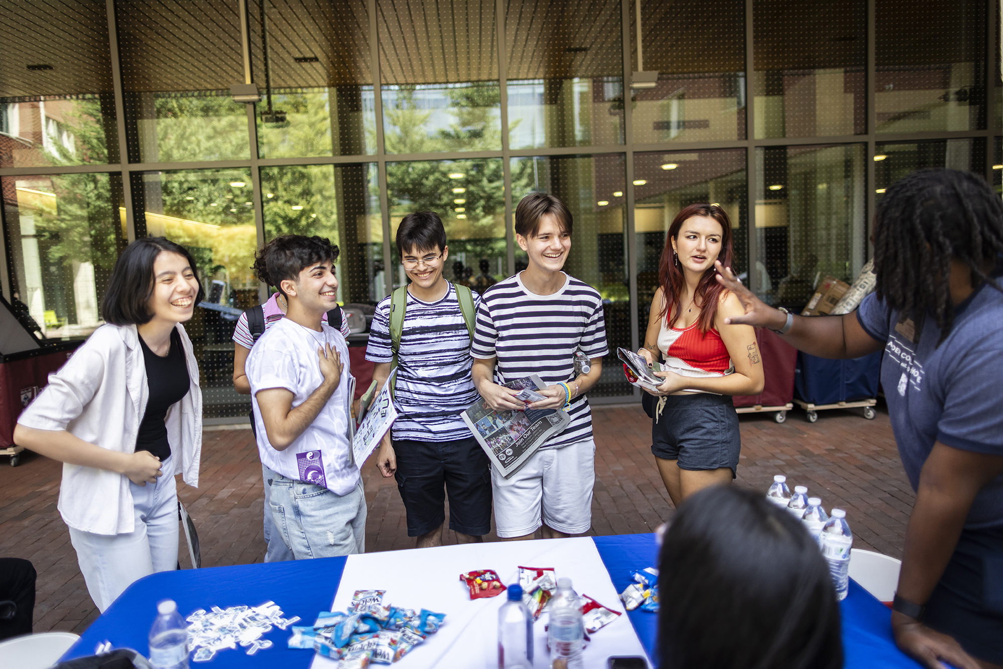Students at an info table at Penn’s Move-In day.