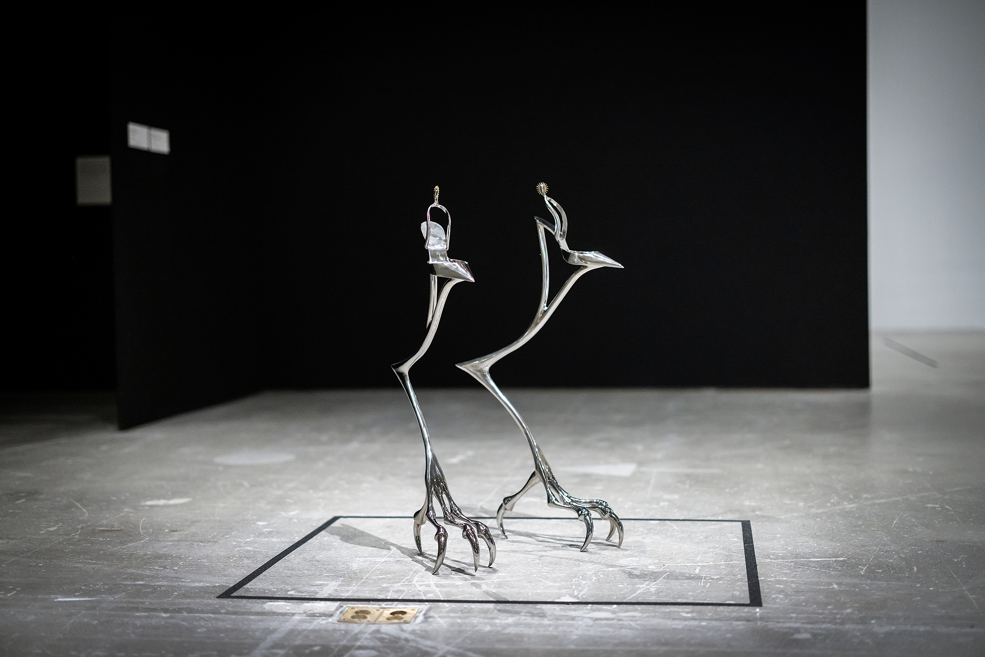 Metal stilts on heels, as sculpture.