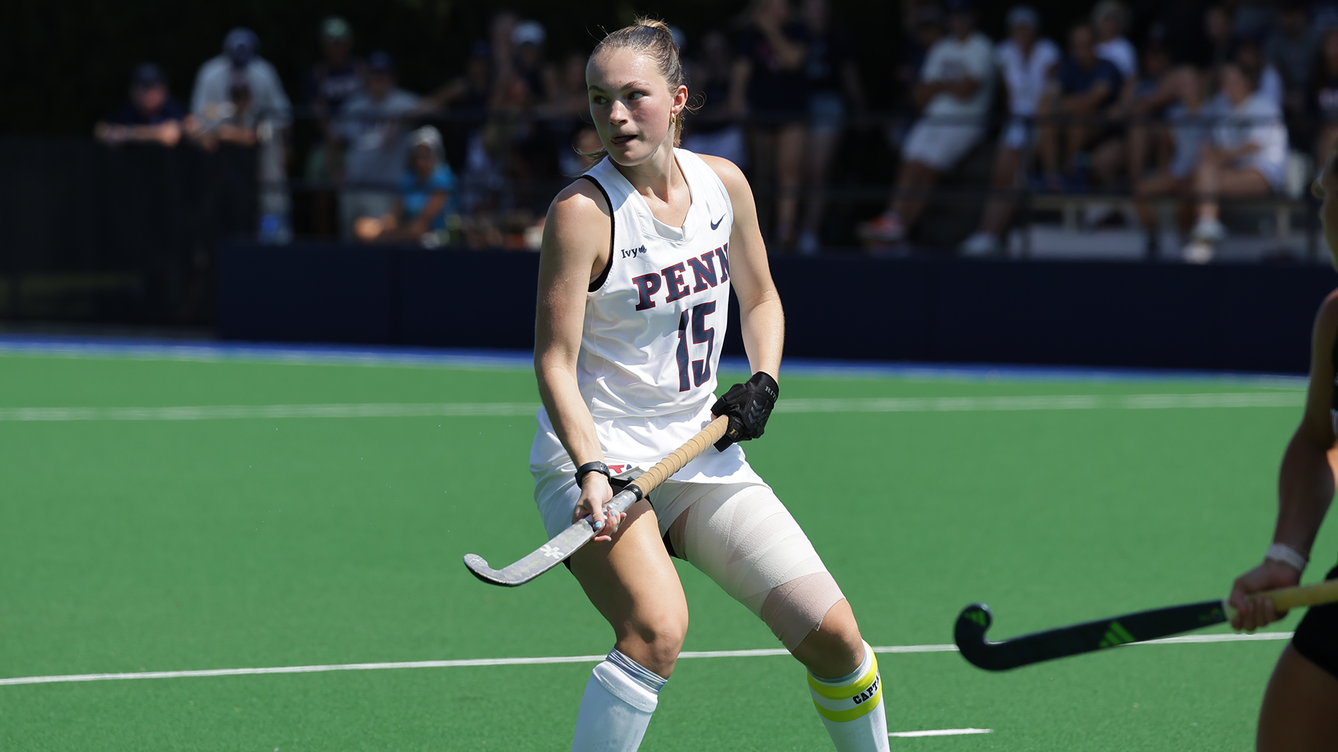 Allison Kuzyk patrols the field with her stick in her hands during a game.