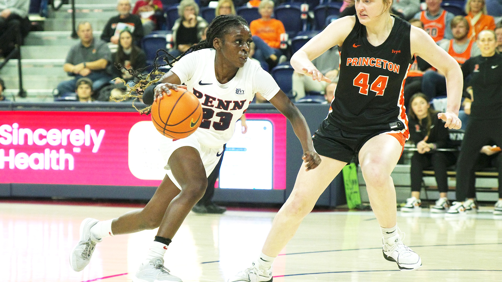 Ese Ogbevire dribbles past a Princeton defender on her way to the basket at the Palestra.