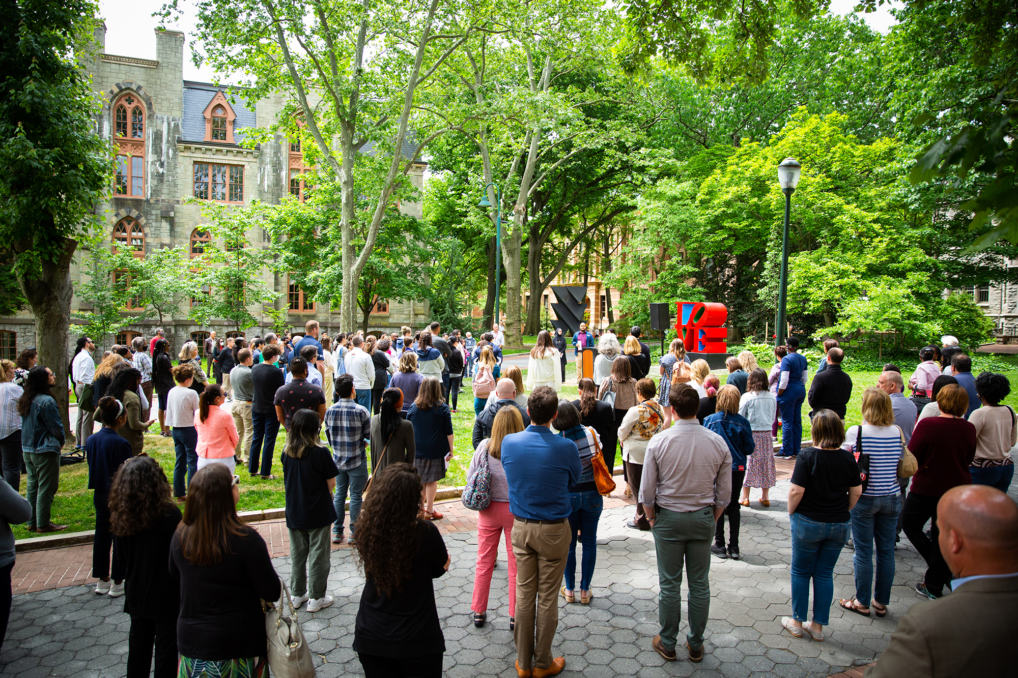 Penn’s chaplain Chaz Howard addresses a crowd assembled at Robert Indiana’s LOVE statue on Penn’s campus in front of College Hall.