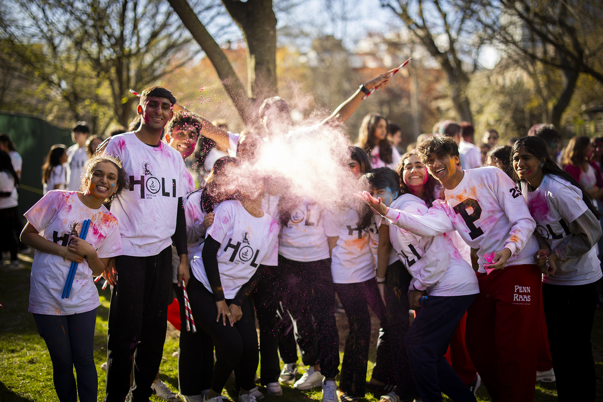 Penn students pose for a photo on College Green during Penn’s Holi celebration.