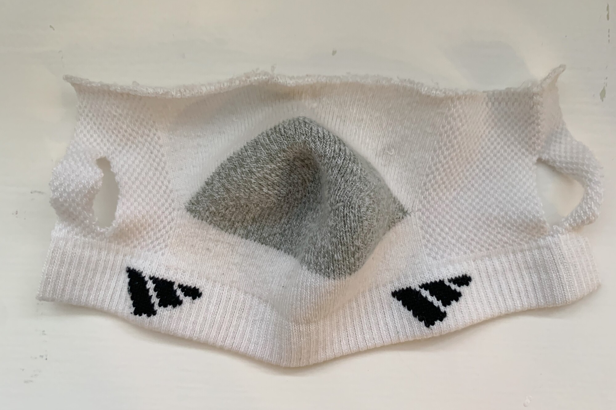 a mask made from the heel portion of a sock