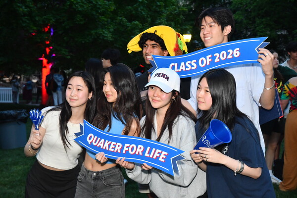 Six second-year Penn students pose for pictures at U-Night.