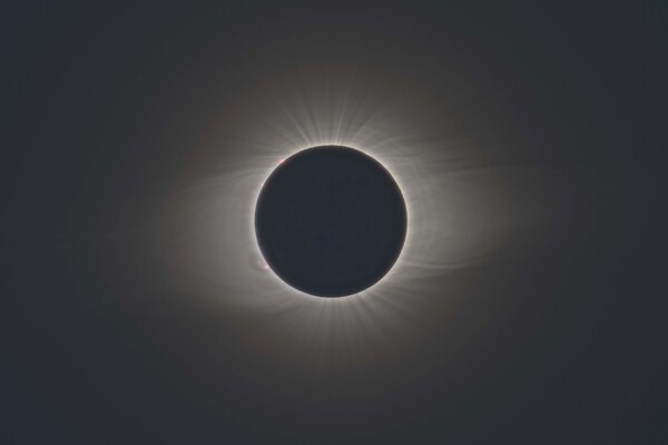 the solar eclipse surrounded by its corona