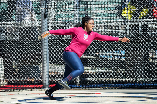 Sophomore thrower Mayyi Mahama prepares to throw the discus from the throwing circle during a meet.