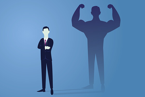 cartoon of a businessman whose shadow is flexing very large biceps