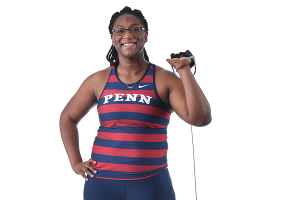 Against a white background, Mayyi Mahama of the track and field team poses in her uniform.