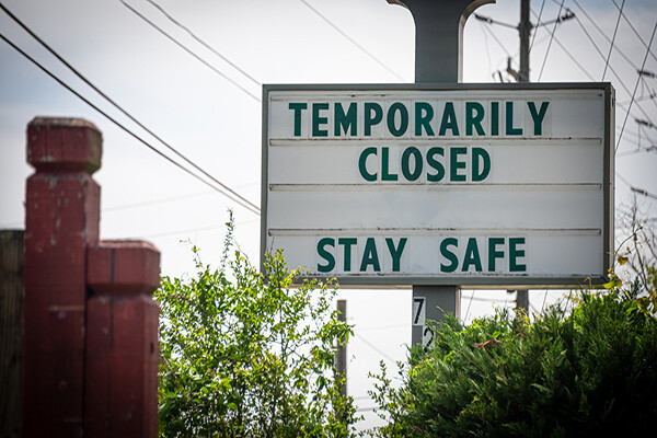 Marquee sign that reads Temporarily Closed, Stay Safe.