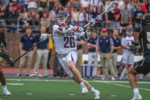 Against Army, Sam Handley makes a move up the field with the stick and ball.