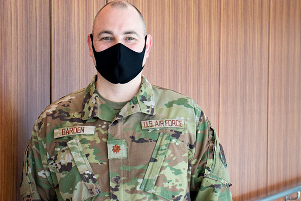 Kerwin Barden wearing a face mask wearing military fatigues.