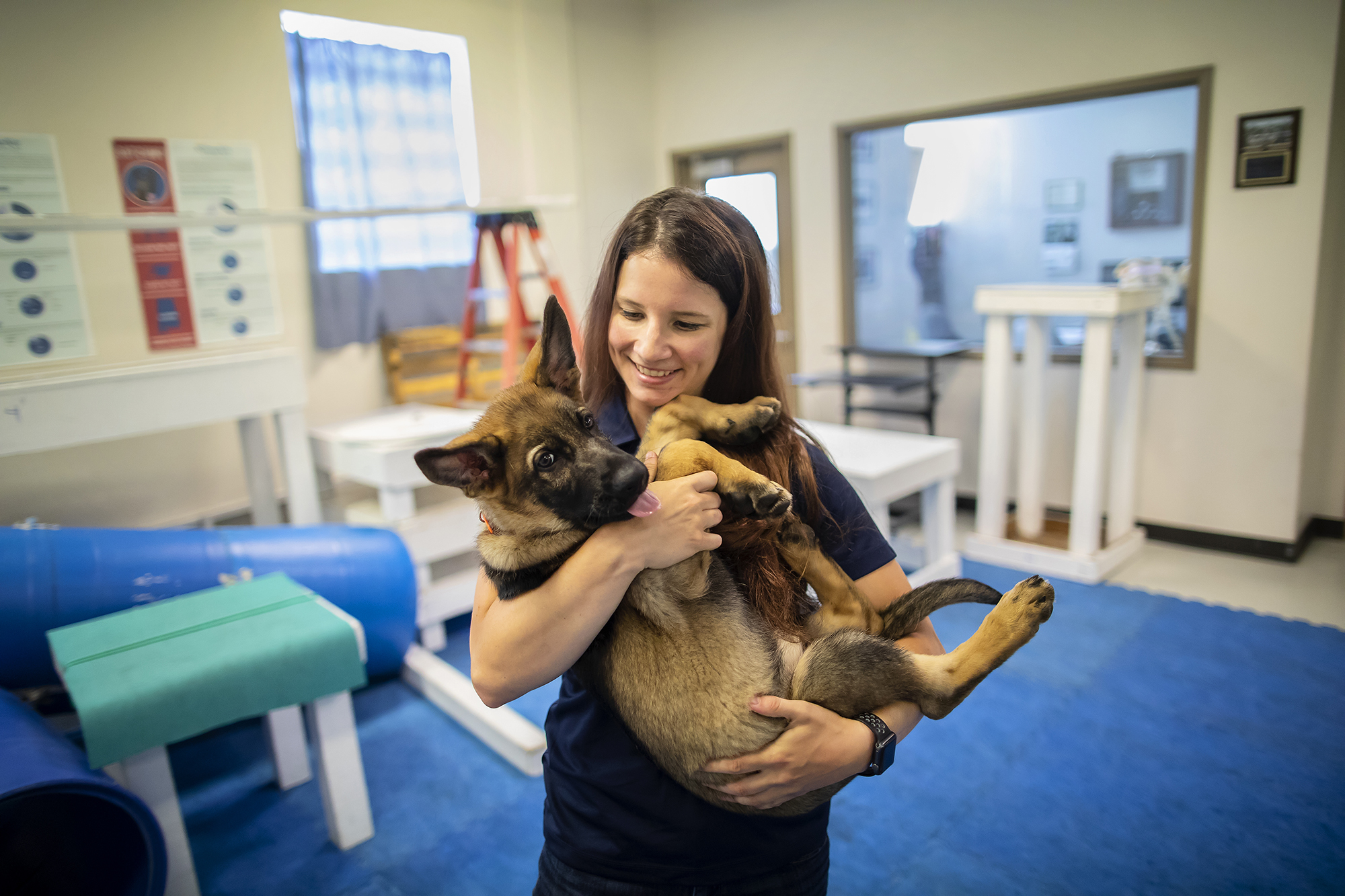 Meghan Ramos Holding Puppy