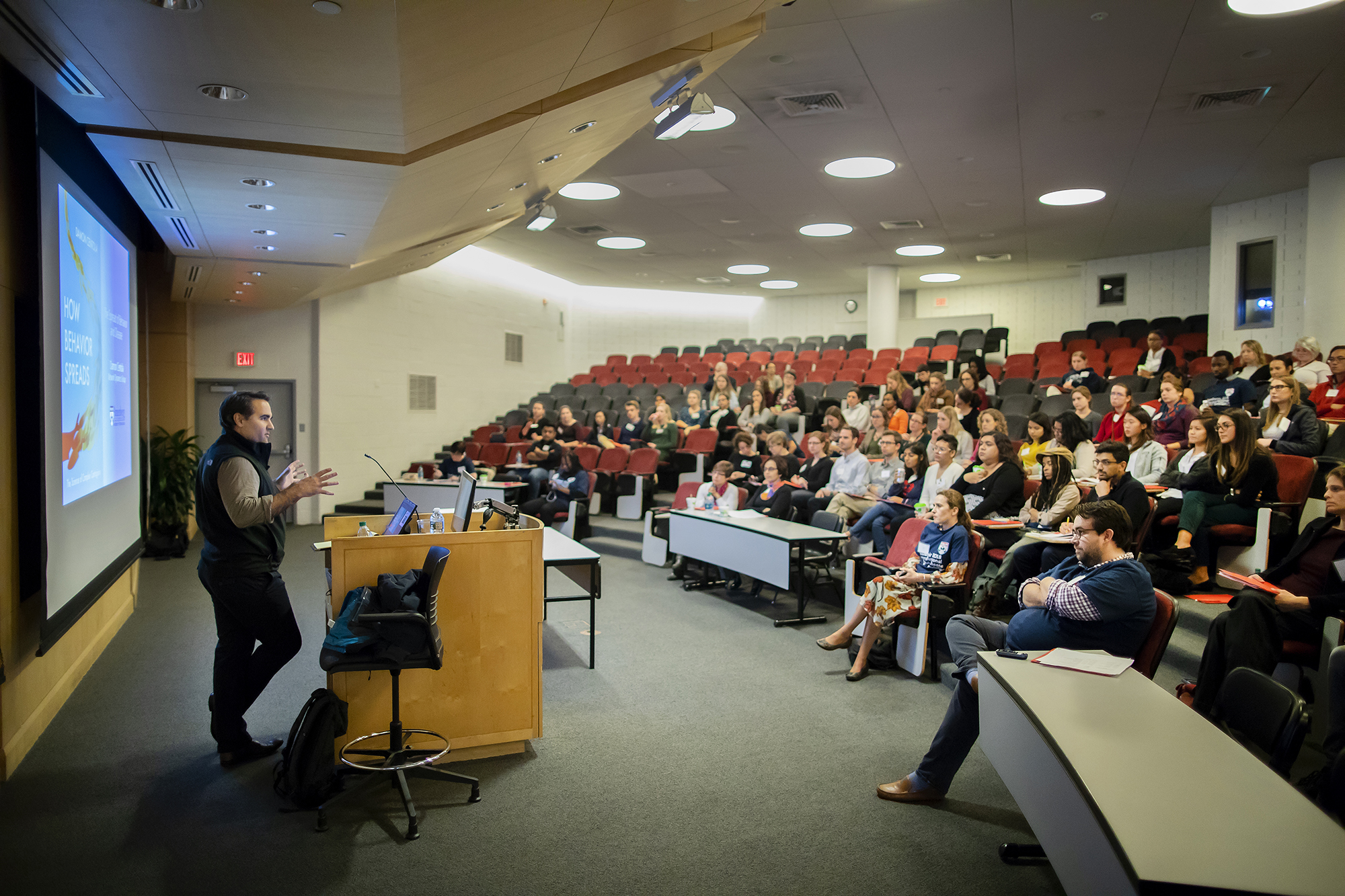 Damon Centola speaks to students in an auditorium