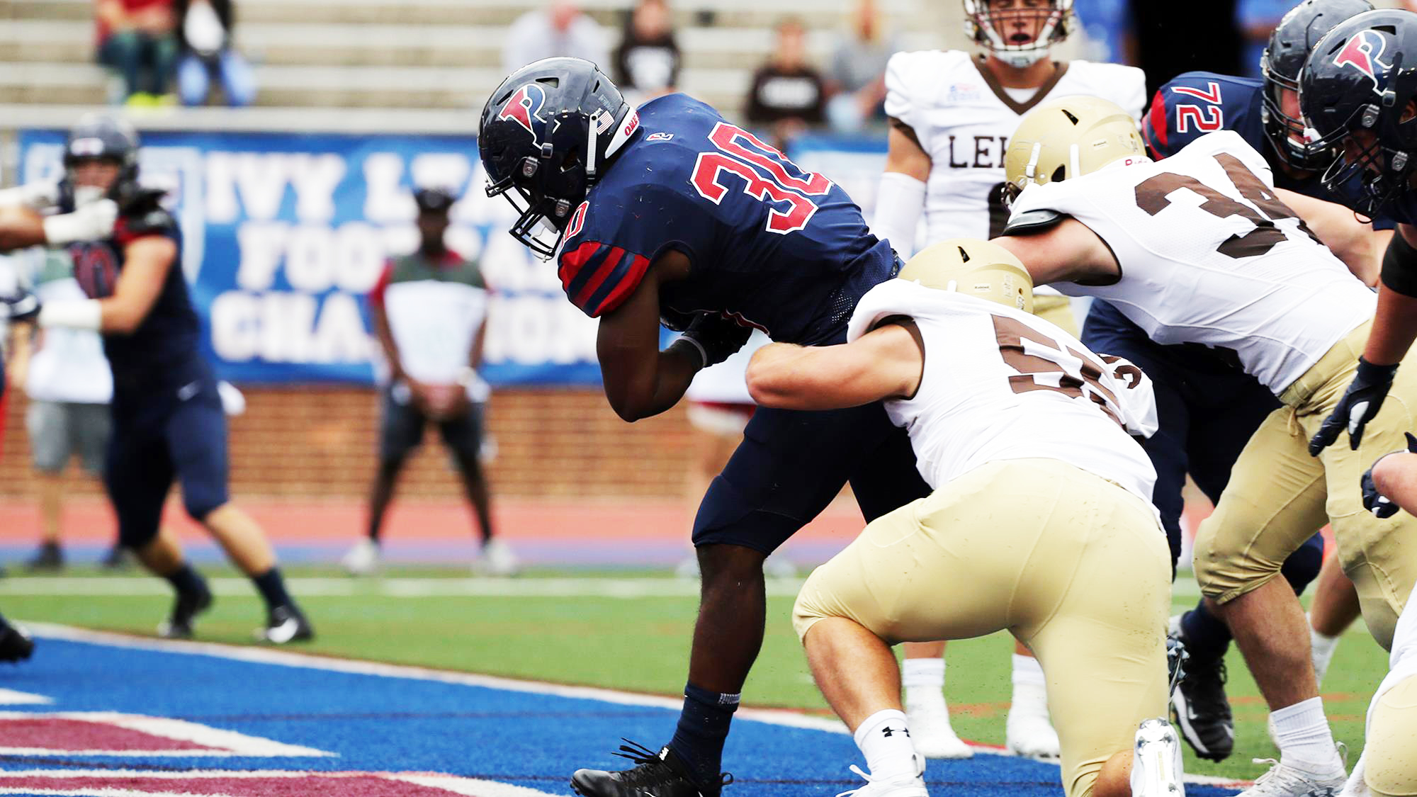 running back breaks through tackles into end zone