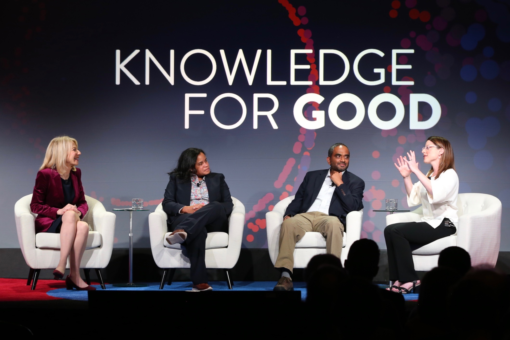 Penn President Amy Gutmann holds a conversation with three professors at a Power of Penn event in Boston.