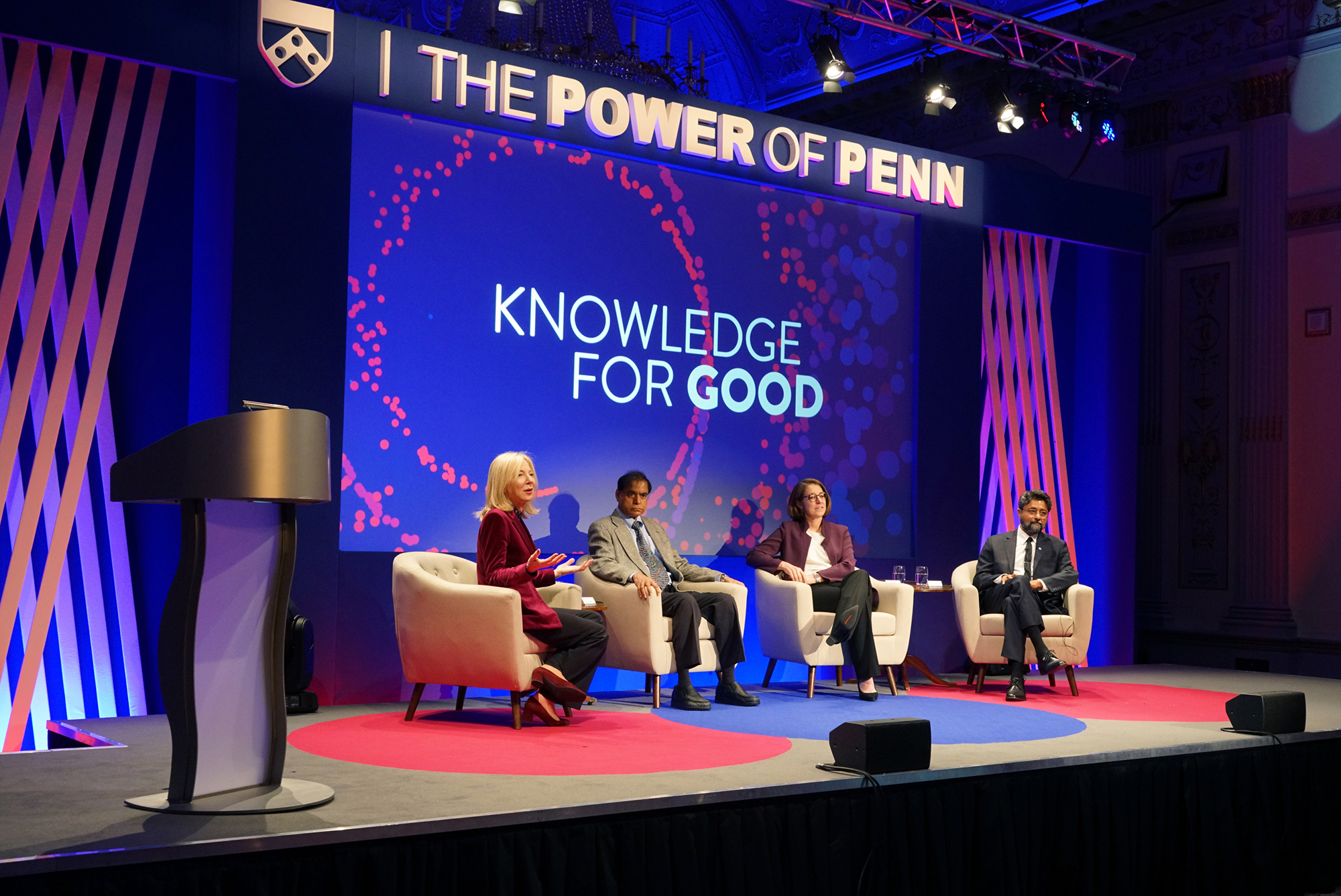 group-sitting-on-stage-power-of-penn-backdrop