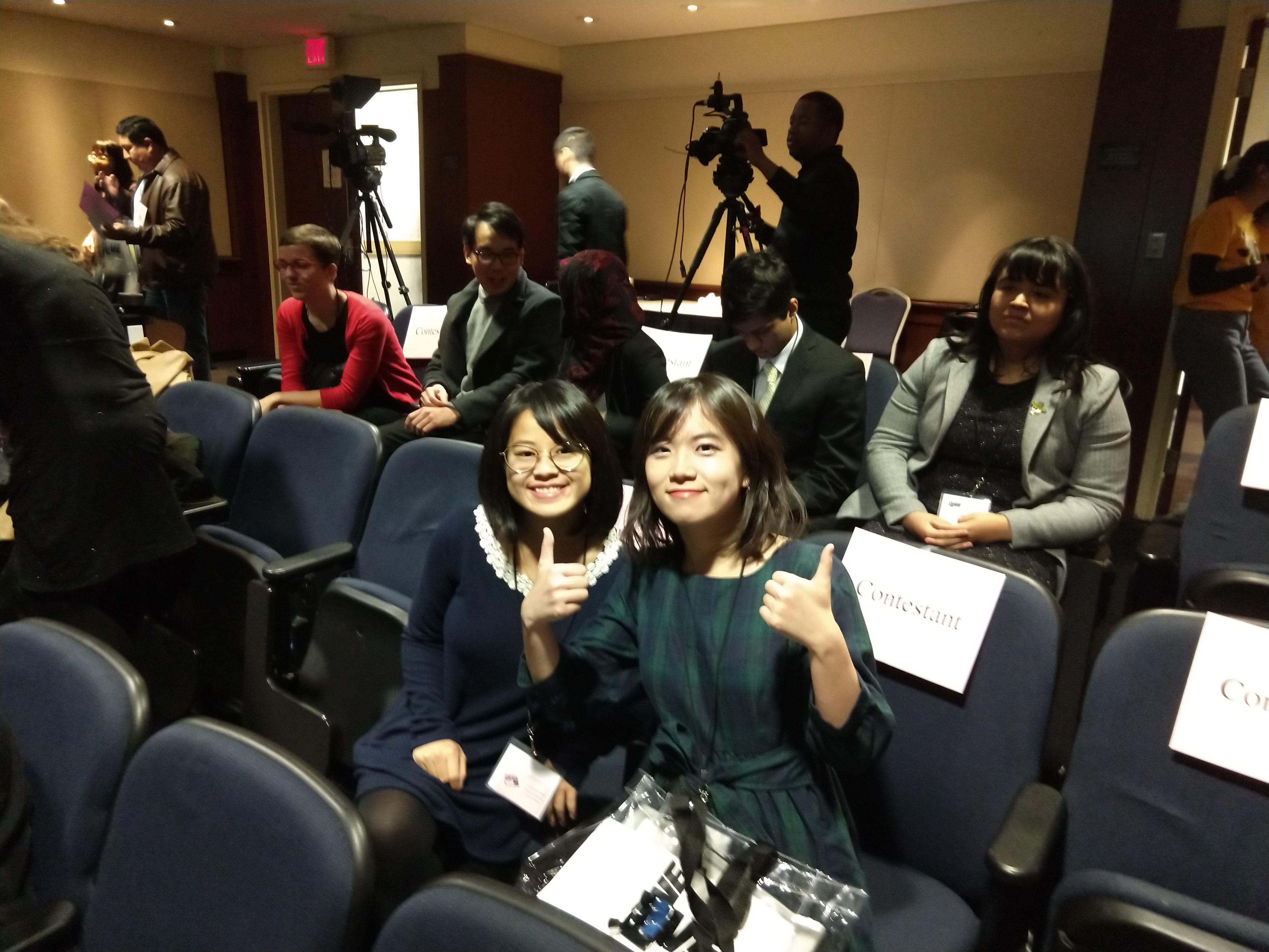 Barbara and Zhizou pose for a photo in their seats at the J.LIVE competition