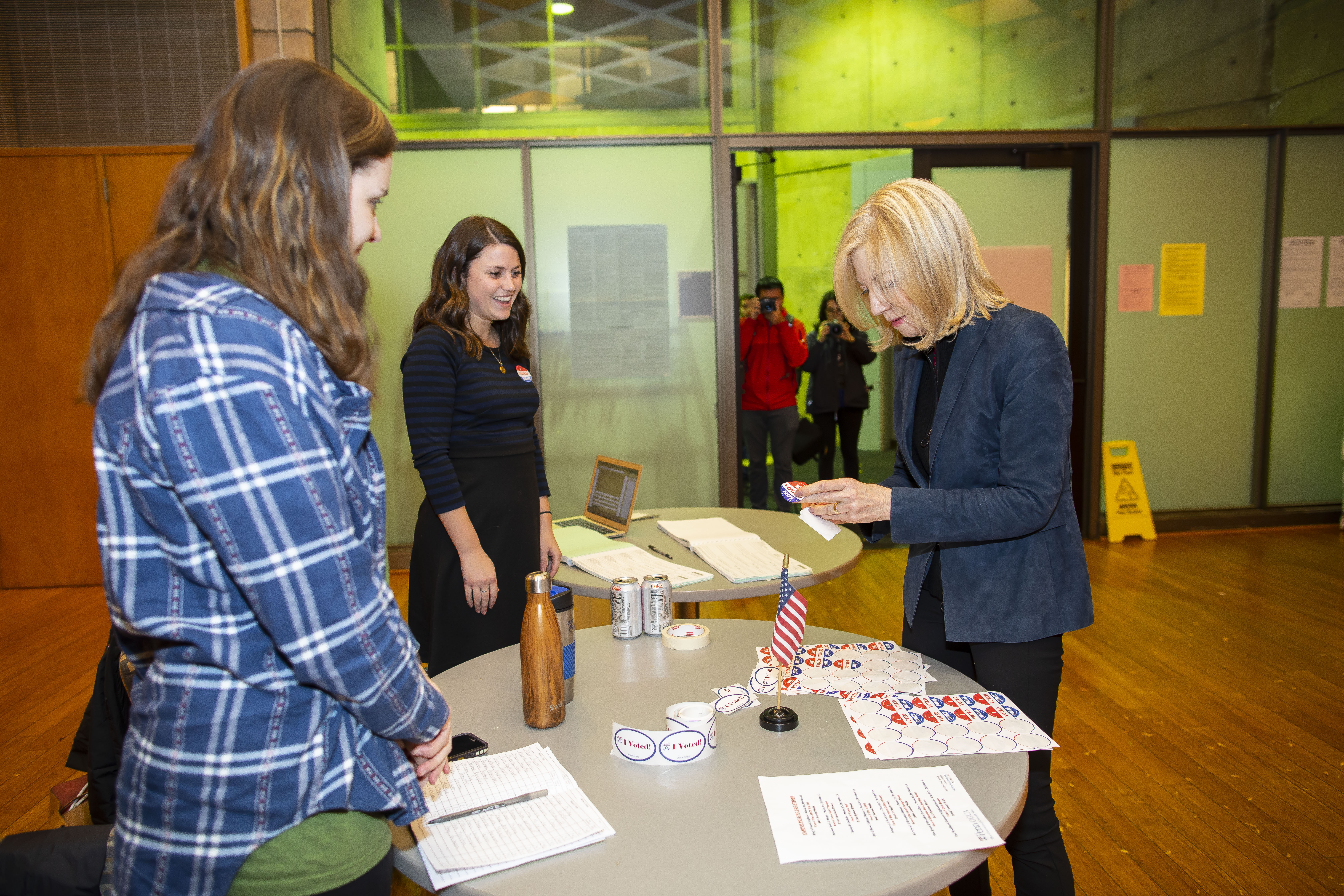 Dr. Gutmann chooses an I Voted sticker from a table in Vance Hall