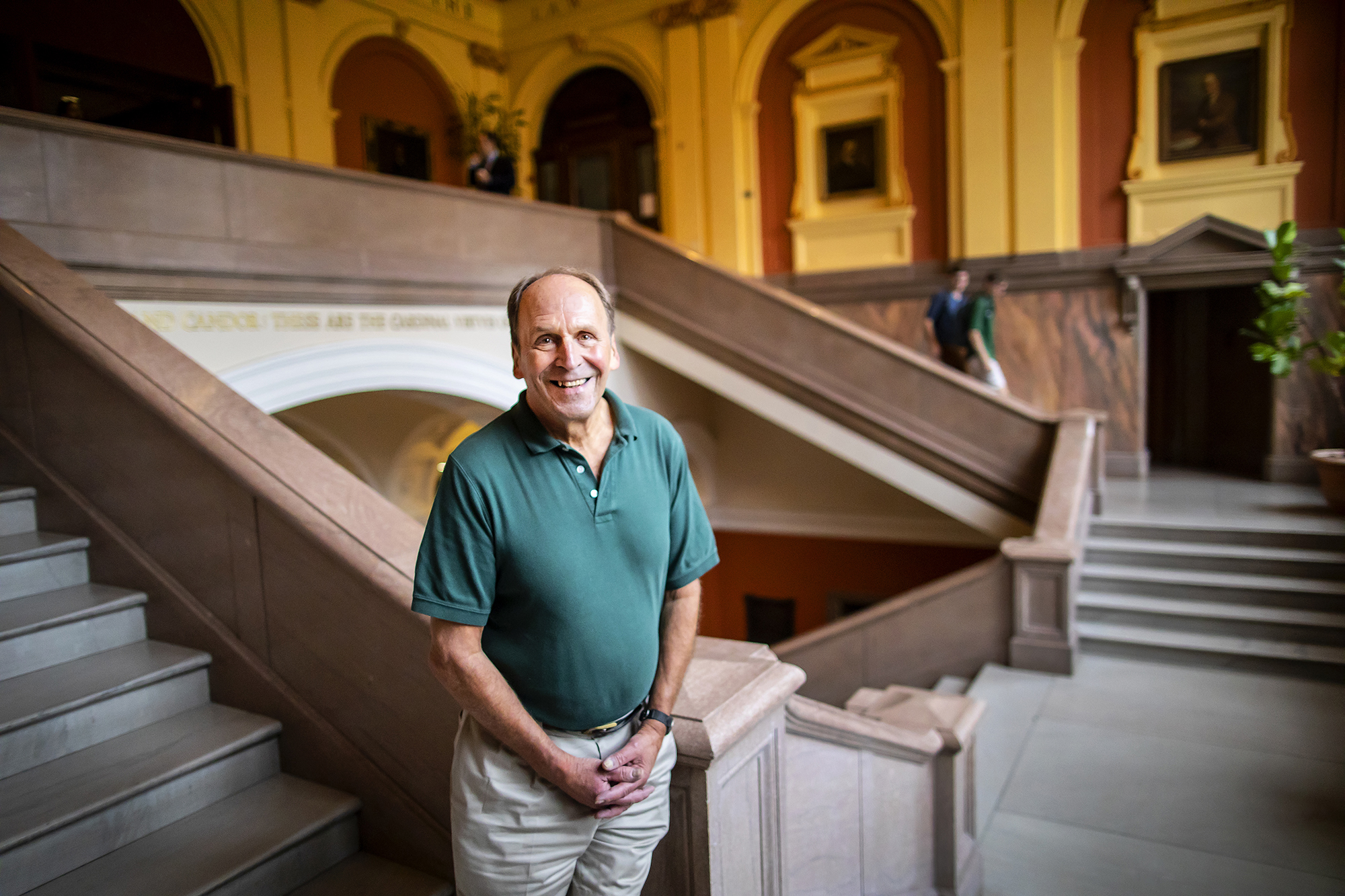 Stephen Burbank poses in Silverman Hall at Penn Law School on the stairs