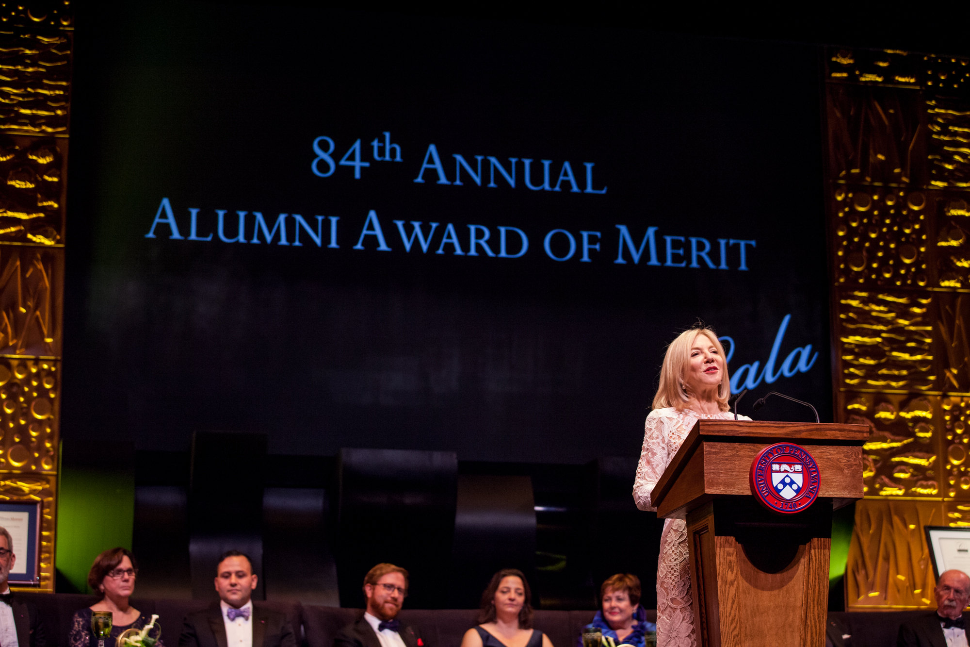 President Amy Gutmann addresses the crowd at the podium