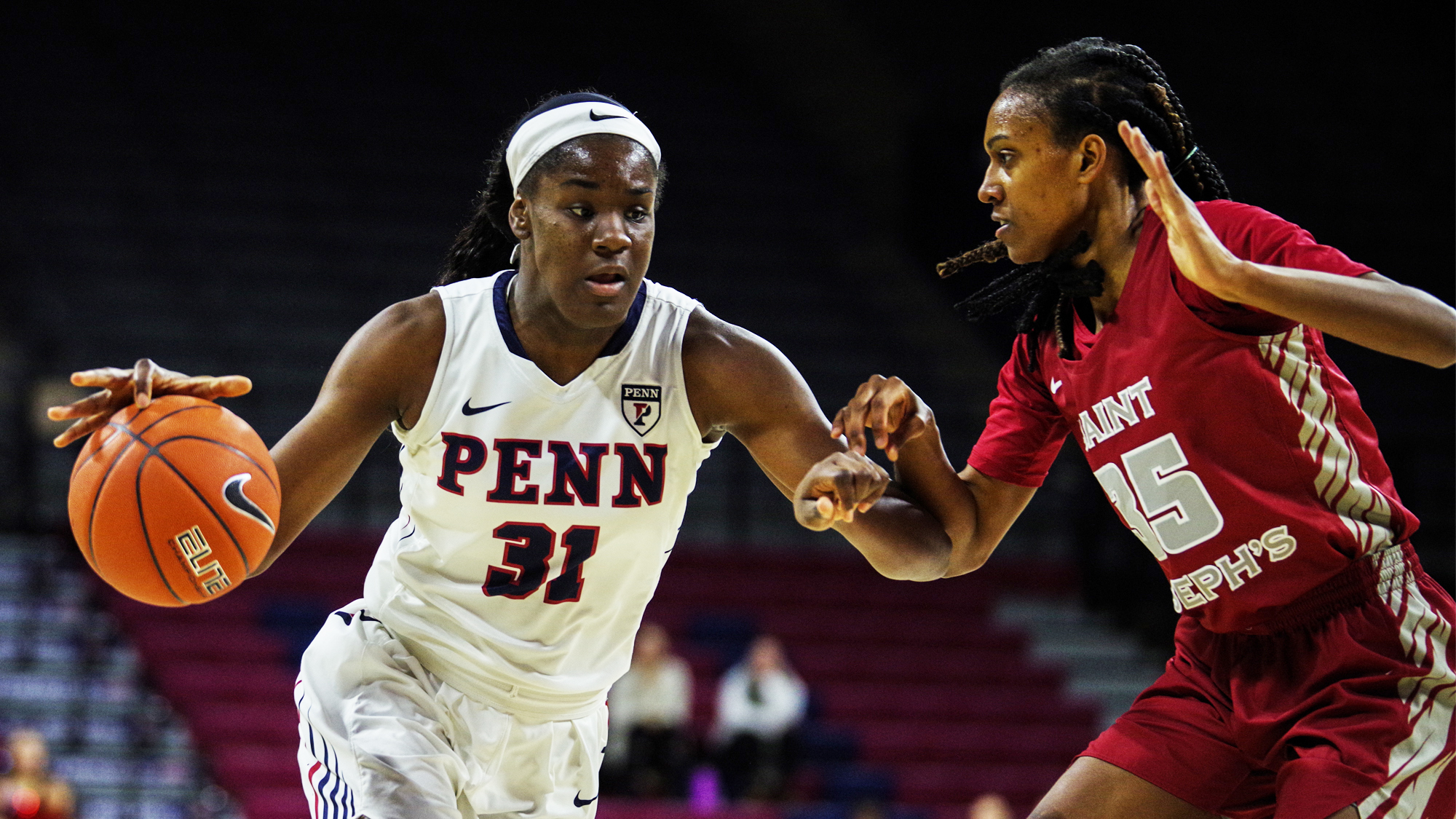 Eleah Parker drives to the basketball against Saint Joseph's.